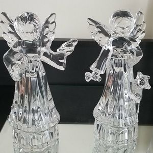 Two beautifully detailed glass statues.